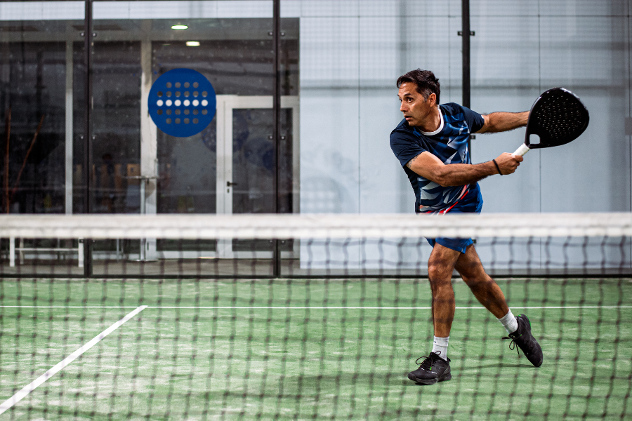 a man holding a tennis racket